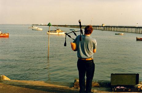  Southend-on-Sea piper playing in front of the pier