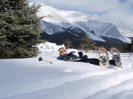 Tara laying on the snow by Red Deer 